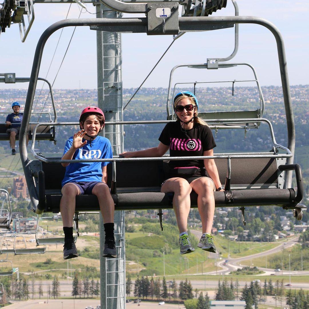 A mother and son ride the chairlift at Downhill Karting Calgary.
