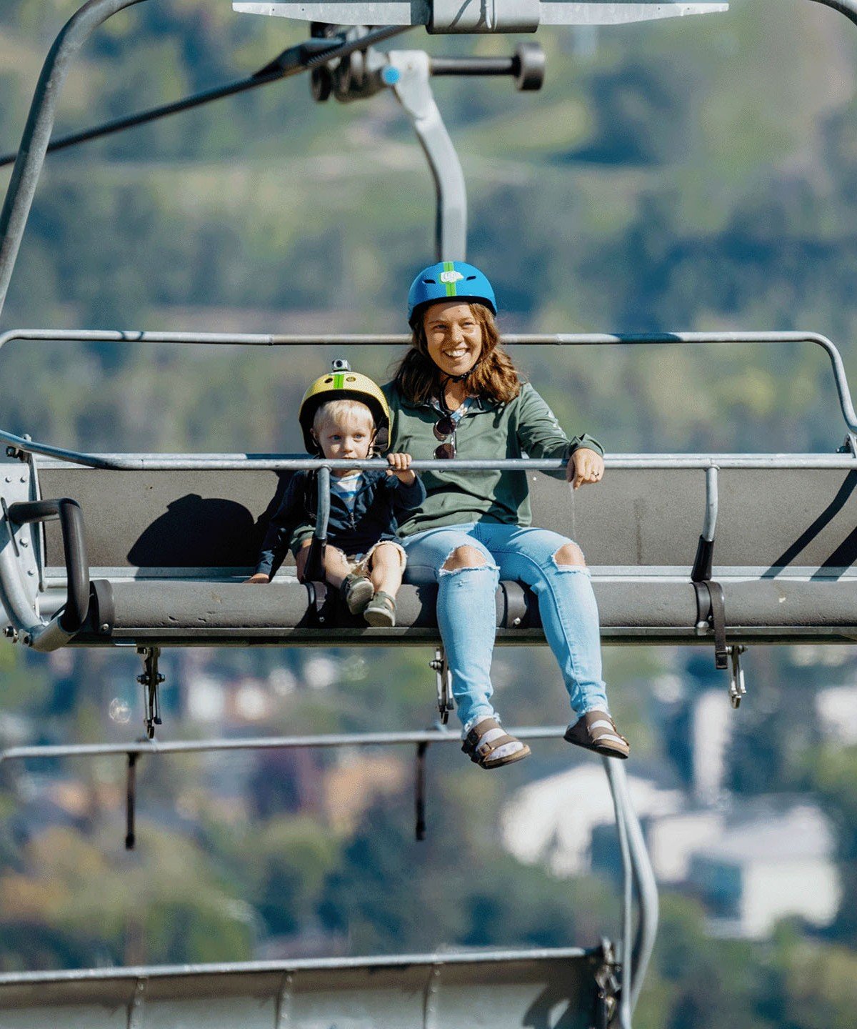 A mother and her son ride the chairlift to the top of the tracks at Downhill Karting Calgary.