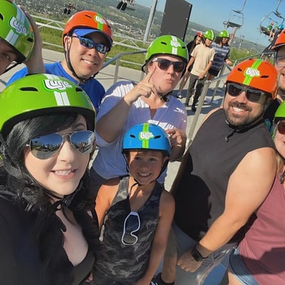 A group of people pose for a photo at Downhill Karting Calgary.