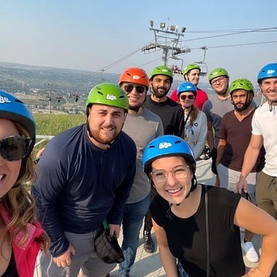 A group of friends pose for a photo at Downhill Karting Calgary.