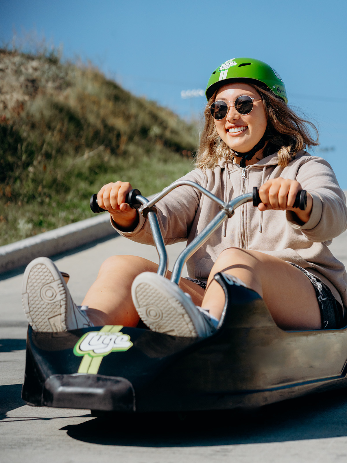 A lady rides the Downhill Karting Calgary tracks alone.