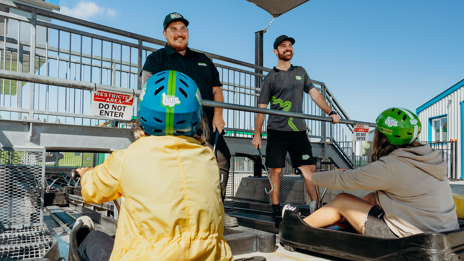 Downhill Karting Calgary employees engage with guests at the end of their ride.