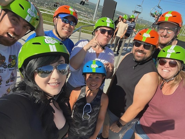 A group of people pose for a photo at Downhill Karting Calgary.